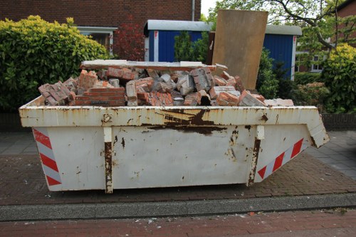 People sorting furniture for disposal in London