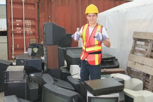 Professional waste clearance team handling furniture removal